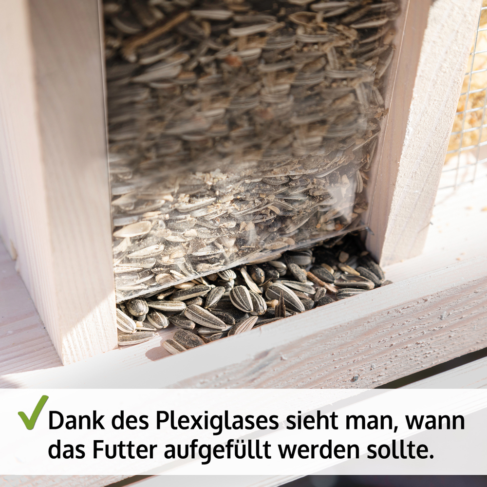 Vogelhaus Bird Kitchen mit einer transparenten Plexiglaswand durch die der Füllstand des Futters sichtbar ist damit man erkennt wann das Futter aufgefüllt werden sollte